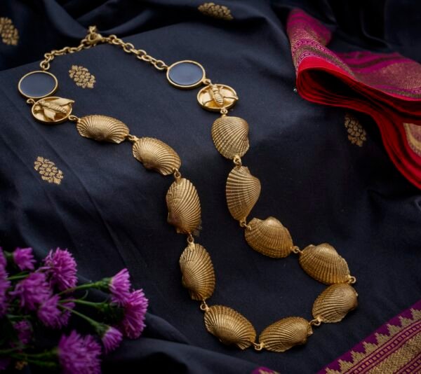 Necklace shells with fly